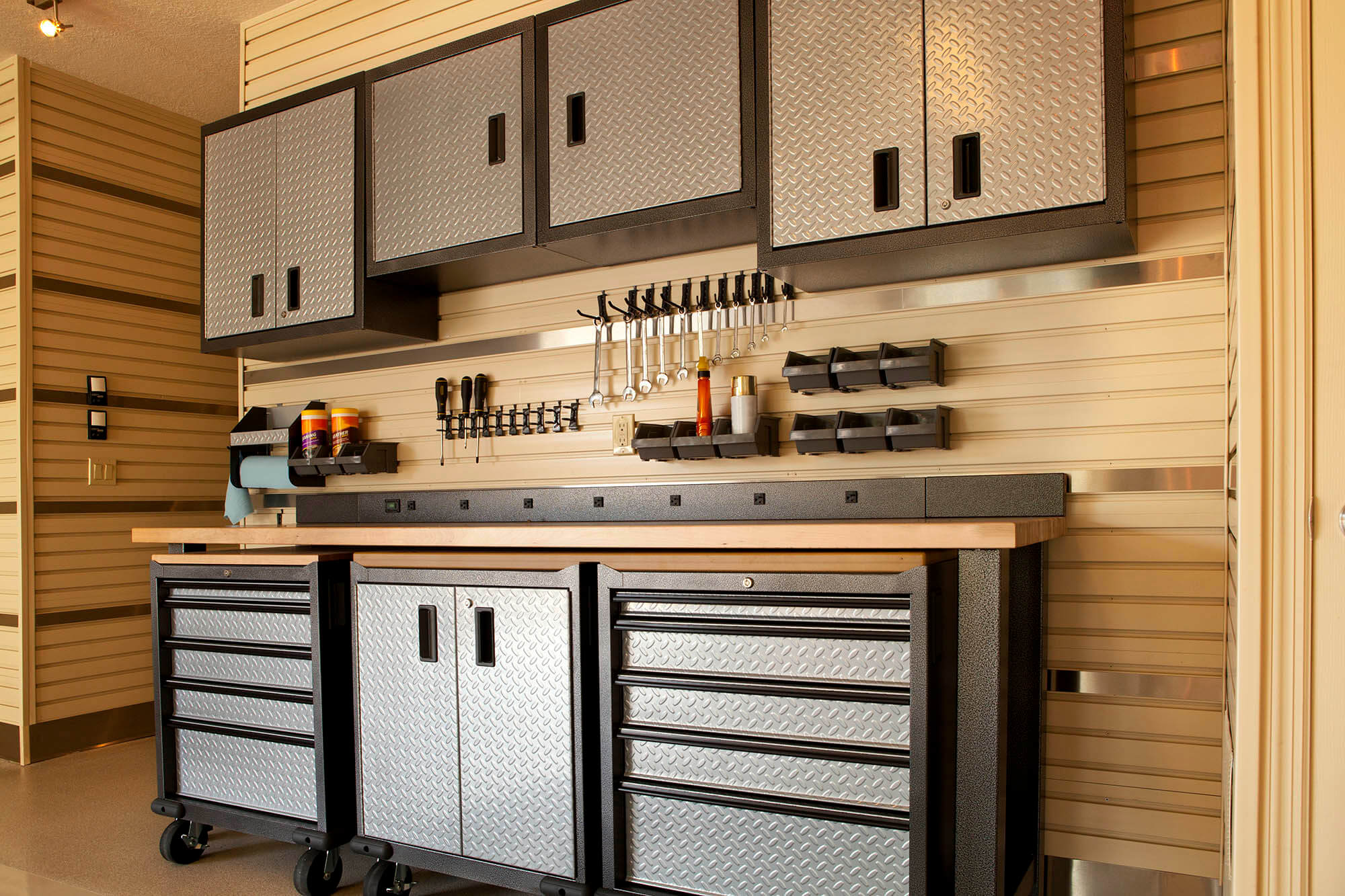 Neat and organized garage with cabinetry