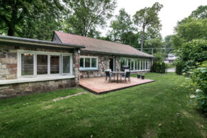 Inside and outside of ranch house in suburbs in the summer time