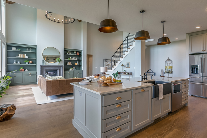 Kitchen island with gray and white colors staged for Tour