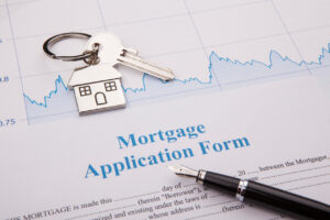 An empty mortgage application form with house key